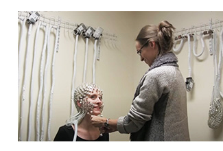  Dr. Lenartowicz applying an EEG cap