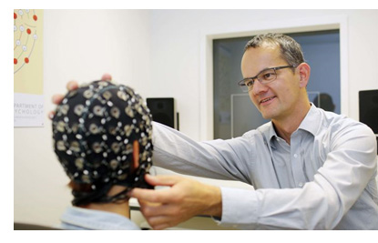 Dr. Debener working with EEG cap