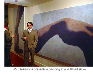 Mr. Desjardins presents a painting at a 2004 art show