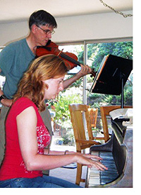 Dr. Makeig and Professor Milne playing music together