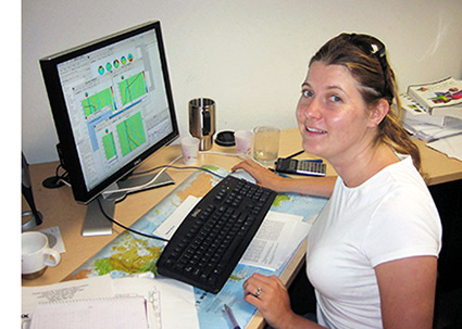 Professor Milne at her desk at SCCN